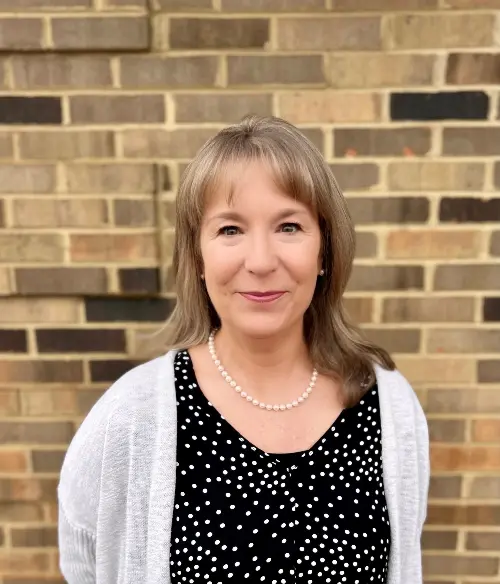 kim-m-headshot-scaled-custom-500x584